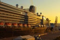 Close up view of huge luxury cruise ship glides out of the port of Koper during magic sunrise