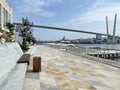 Vladivostok, Russia, September, 09, 2023. Korabelnaya Embankment, Golden Bridge, Grand Hotel and SPA