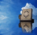 Koran with Clouds in the sky