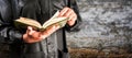 Koran in hand - holy book of Muslims Royalty Free Stock Photo