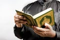 Koran in hand - holy book of Muslims ( public item of all muslims ) Royalty Free Stock Photo