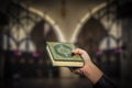 Koran in hand - holy book of Muslims public item of all muslims Royalty Free Stock Photo