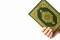Koran in hand - holy book of Muslims women ( public item of all muslims ) Royalty Free Stock Photo