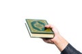 Koran in hand ,Quran in hand - holy book of Muslims , on white background Royalty Free Stock Photo
