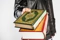 Koran in hand ,Quran in hand - holy book of Muslims , on white background Royalty Free Stock Photo