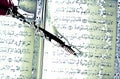 The koran, the holy book of Islam, and an ancient pen