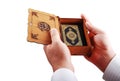 Koran, islam holy book hold by male hands