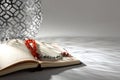 Koran with Muslim prayer beads on table Royalty Free Stock Photo