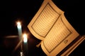 Koran or quran holy book with candles Royalty Free Stock Photo