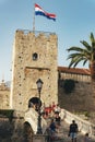 Korcula Croatia - 10 August 2021: Main entrance in the old town of Korcula with walking people Royalty Free Stock Photo