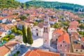 Korcula island. Town of Vela Luka church tower and rooftops aerial view
