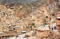 Rural women meeting outdoor in small mountain village with poor clay houses