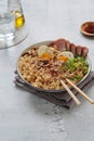 A bowl with ramen, an Asian noodle soup