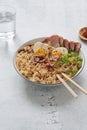 A bowl with ramen, an Asian noodle soup