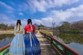 Korea during winter with lady Korean national dress at Gyeongbokgung Palace. Seoul,South Korea.