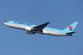 Korean Air Boeing 777 large commercial aircraft climbing out on departure from Sydney Airport