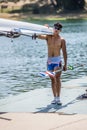 Korean athlete on a World Rowing Cup Competition carries a boat Royalty Free Stock Photo