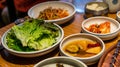 Korean barbecue sidedish with green lettuce, pickle and Kimchi Royalty Free Stock Photo