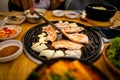 Korean Barbecue, where you could grill your own selected meat, and have side dishes such as the kimchi soup. Royalty Free Stock Photo