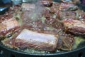 Korean Barbeque Beef Short Ribs Kalbi or Galbi sizzling on a hot plate Royalty Free Stock Photo