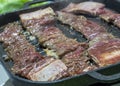 Korean Barbequed Beef Short Ribs Kalbi or Galbi sizzling on a hot plate Royalty Free Stock Photo