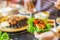 Korean BBQ bulgogi beef and lettuce held in hand, Selective focus Royalty Free Stock Photo