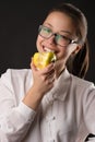 Korean beautiful smiling girl eating green apple Royalty Free Stock Photo