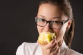 Korean beautiful teenager girl eating green apple Royalty Free Stock Photo