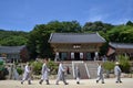 The Korean-Buddhist monks walking in a line. Pic was taken around Beomeosa in August Royalty Free Stock Photo