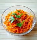 Korean carrot salad finely chopped carrots, garlic, sunflower oil and spices-for instance, cilantro. Traditional Korean food.