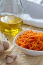 Korean carrots with ingredients for cooking : carrots grated straw, oil, pepper and garlic.