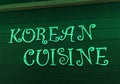 Korean Cuisine neon sing on a wooden wall