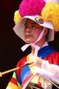 Korean drummer playing the traditional hourglass-shaped drum also known as janggu