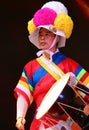 Korean drummer playing the traditional hourglass-shaped drum also known as janggu