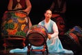 Korean female actress playing traditional drum