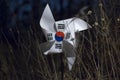 The Korean flag shaped like a pinwheel in the forest at dark night