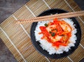 Korean food, top view kimchi with a rice in bowl tasty yummy and spicy on wood table background for healthy.