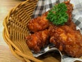 Korean foods. Fried chickens in basket on table.