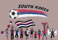 Korean football fans cheering with South Korea flag colors in fr Royalty Free Stock Photo