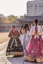 Korean girls in colurful national traditional costumes hanbok walking in a gyeongbokgung palace in Seoul South Korea