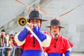 Korean guardsmen with traditional musical instrument