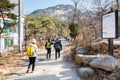 Korean hikers climbing the rock at the Bukhansan Mountain National park in Soeul, South Korea