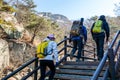 Korean hikers climbing the rock at the Bukhansan Mountain National park in Soeul, South Korea