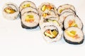 Korean, japanese sushi placed on a white background arranged in rows