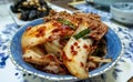 Korean kimchi slices stacked in a small bowl as side dish to a meal