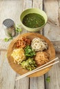 Korean kuksi soup with vegetables, scrambled eggs, beef and noodles in a bowl and chopsticks on a wooden background Royalty Free Stock Photo