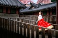 Korean lady in hanbok dress runing  in an ancient palace Royalty Free Stock Photo
