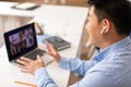 Korean Male Teacher Having Video Call Via Laptop At Workplace Royalty Free Stock Photo