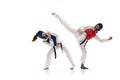 Korean martial art. Asian sport wrestling, fighting battle. Two young girl in white dobok, kimono practicing taekwondo