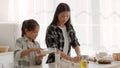 Korean Mom And Daughter Baking Cookies Kneading Dough In Kitchen Royalty Free Stock Photo